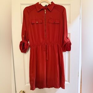 Red-orange shirt dress with gold zipper accent
